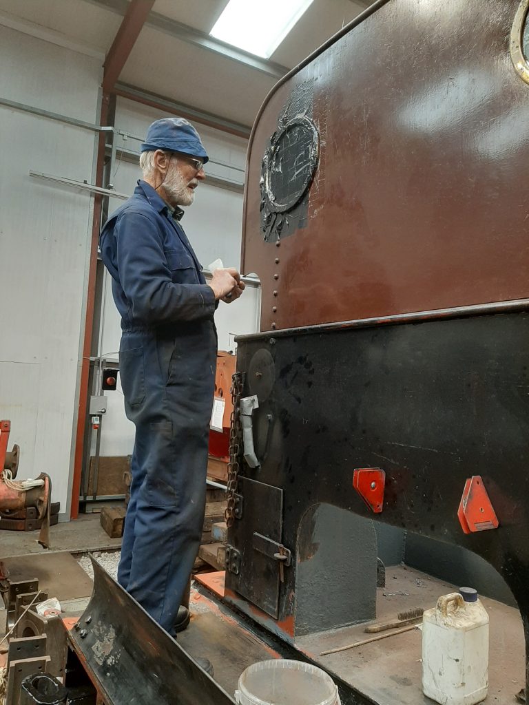 Roger about to remove protective tape from one of the spectacle plate glasses on FR 20's tender